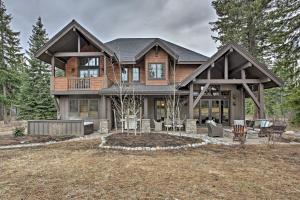 a large house with a gambrel roof at Cle Elum Home on Golf Course with Fire Pit and Hot Tub in Cle Elum