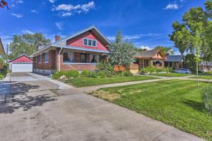 a house with a red roof and a driveway at Charming Historic Ogden Home with Private Backyard! in Ogden
