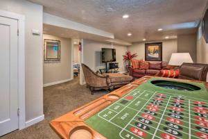 a living room with a table with a roughen at Charming Historic Ogden Home with Private Backyard! in Ogden