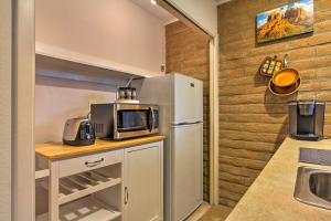 a kitchen with a refrigerator and a microwave at Romantic Sedona Suite with Patio Less Than 1 Mi to Trails in Sedona +21 photos