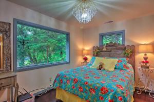 a bedroom with a bed with a dog laying on it at Quiet and Romantic Riverfront McKenzie Bridge Cabin! in McKenzie Bridge