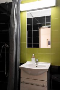 a bathroom with a sink and a mirror at Burgos Guest House in Évora +32 photos