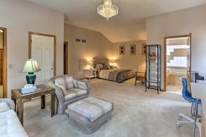 a large living room with a bed and a couch at Eagan Home with Porch - 5 Mi to Mall of America! in Eagan
