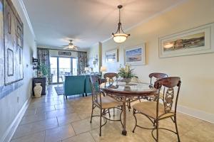 a dining room with a table and chairs at Beachfront Condo with Pool Access in Biloxi! in Biloxi