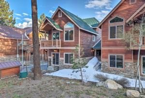 a home with a wooden house with a yard at Mammoth Lakes Townhome - 10-Min Walk to Village! in Mammoth Lakes