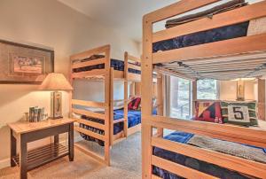 a bedroom with two bunk beds and a desk at Mammoth Lakes Townhome - 10-Min Walk to Village! in Mammoth Lakes