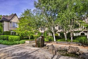 a house with trees and a bench in a yard at Modern Vancouver Townhome - Right on Main St! in Vancouver