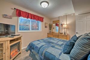 a bedroom with a bed and a fireplace at Game Room and Hot Tub Salt Lake City Area Apt in Bluffdale