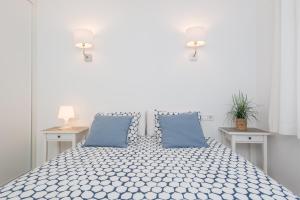 A bed or beds in a room at Apartamento Pinebeach
