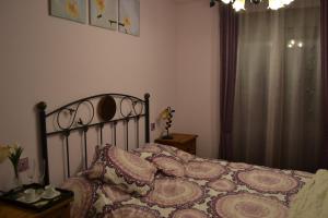 En eller flere senge i et værelse på Casa rural La Senderilla