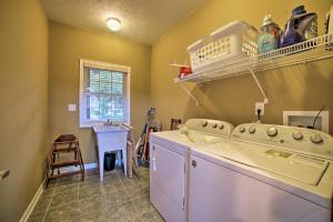 a laundry room with a washer and dryer at Family-Friendly Massanutten Home with Slope Views! in McGaheysville +24 photos