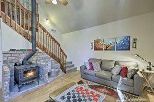 
a living room filled with furniture and a fire place at Serene Home Situated in Forest, 4Mi to NAU Campus! in Flagstaff

