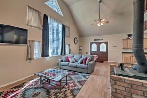 
a living room filled with furniture and a fire place at Serene Home Situated in Forest, 4Mi to NAU Campus! in Flagstaff
