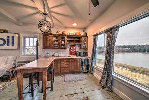a kitchen with a table and a large window at Lakefront Studio Guest Home on Hermann Wine Trail! in New Haven