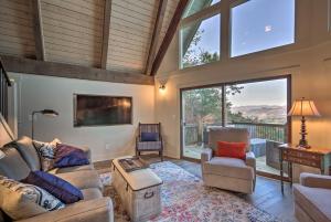 a living room with a couch and chairs and a large window at Brevard Chalet with Stunning Blue Ridge Mtn Views! in Brevard