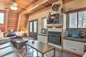 a living room with a fireplace and a tv at Peaceful Georgetown Home - 13 Mi to Lewes Beach! in Georgetown