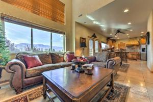 a living room with couches and a table at Eden Townhome with Mtn View and Shuttle to Powder Mtn! in Eden