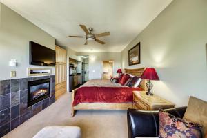 a bedroom with a bed and a fireplace at Brian Head Lodge #3307 in Brian Head