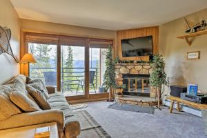 a living room with a couch and a fireplace at 10 Mi to Keystone Updated Mtn-View Condo in Silverthorne