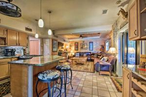 a kitchen with a bar and a living room at Tenn River Cabin with Hot Tub - 10 Mi to Chattanooga in Chattanooga