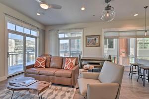 a living room with a couch and a table at Downtown Winter Park Condo - 3 Miles to Ski Resort in Winter Park