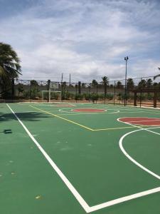 a green tennis court with at Fleixeiras Eco Residence in Trairi