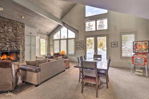 a living room with a table and a fireplace at 4 Mi to Skiing Breckenridge Mountain Retreat! in Breckenridge