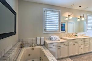a bathroom with a tub and two sinks and a mirror at 4 Mi to Skiing Breckenridge Mountain Retreat! in Breckenridge +16 photos
