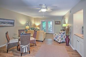 a living room with a couch and a table and chairs at Amelia Island Condo with Onsite Pool and Beach Access! in Amelia Island