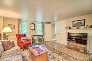 a living room with a couch and a fireplace at Historic Hanover Area Home, 16 Miles to Dartmouth! in Enfield