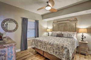 a bedroom with a bed and a ceiling fan at Resort Pool, Gym & Hot Tub: Beachfront PCB Condo! in Panama City Beach +16 photos