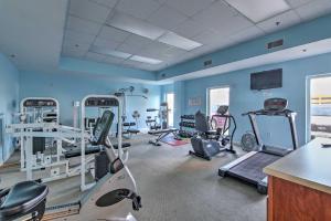 a gym with several exercise equipment in a room at Resort Pool, Gym & Hot Tub: Beachfront PCB Condo! in Panama City Beach