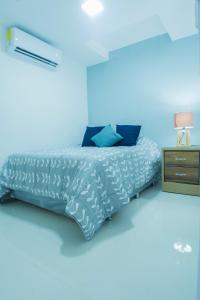 Postel nebo postele na pokoji v ubytování Malecon Premium Rooms & Hotel