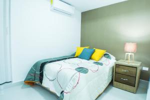 Postel nebo postele na pokoji v ubytování Malecon Premium Rooms & Hotel