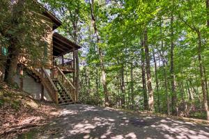 a staircase leading up to a house in the woods at Secluded Forest Cabin, 4 Mi to Downtown Gatlinburg in Gatlinburg