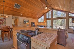 a kitchen with a stove top oven in a room at Sunriver Home with Hot Tub and 8 SHARC Passes in Sunriver