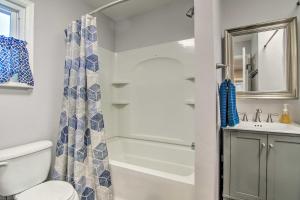 a bathroom with a shower and a toilet and a sink at Colorado Springs Bungalow - Walk to Downtown! in Colorado Springs +16 photos