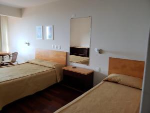 Ilha da Galé Tourist Hotel Fazenda de Bombas tesisinde bir odada yatak veya yataklar