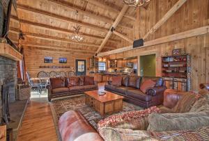 a living room with leather furniture and a fireplace at West Dover Cabin with Game Room, 4 Mi to Mt Snow! in West Dover