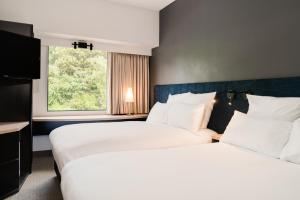 Postel nebo postele na pokoji v ubytování ibis Rotorua