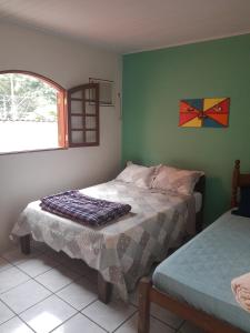 Postel nebo postele na pokoji v ubytování Casa caiçara