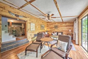 a living room with a table and chairs and a ceiling at Getaway on Center Hill Lake with Decks and Water Views in Silver Point