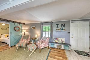 a room with a bed and a table and chairs at Getaway on Center Hill Lake with Decks and Water Views in Silver Point