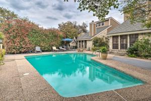 a swimming pool in the backyard of a house at Horseshoe Bay Townhome with Patio and Outdoor Pool! in Horseshoe Bay