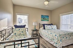 a bedroom with two beds and a window at Spacious Murrells Inlet Hub with Pool, Walk to Shore in Myrtle Beach +27 photos