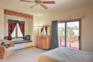 a bedroom with a bed and a balcony at Large Salida Home with Mtn Views - 2 Mi to Downtown! in Salida
