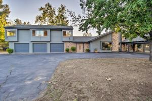 a house with a driveway in front of it at Family Retreat - Private Tennis Court and Game Room in Valley Center