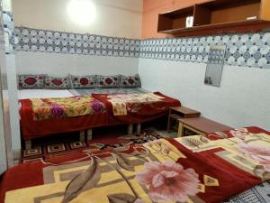 Postel nebo postele na pokoji v ubytování Kashi Annapurna Guest House