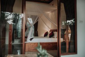 Postel nebo postele na pokoji v ubytování Abimana Ubud