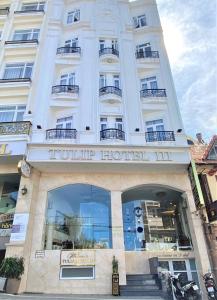 a hotel front view of a building at Tulip Hotel 3 in Da Lat